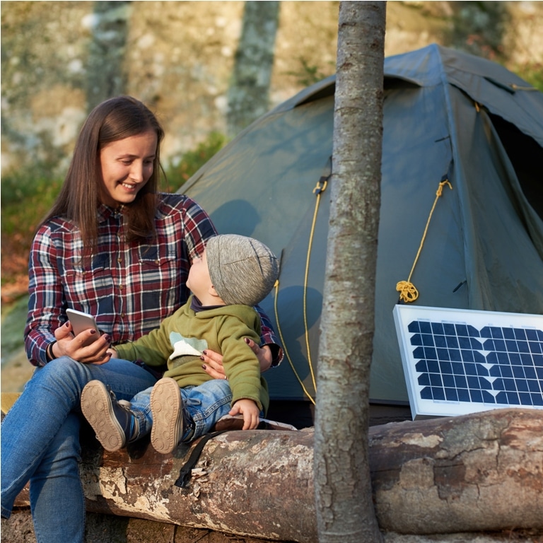 cute girl looks at child sitting on log in forest 2022 05 20 20 31 34 utc