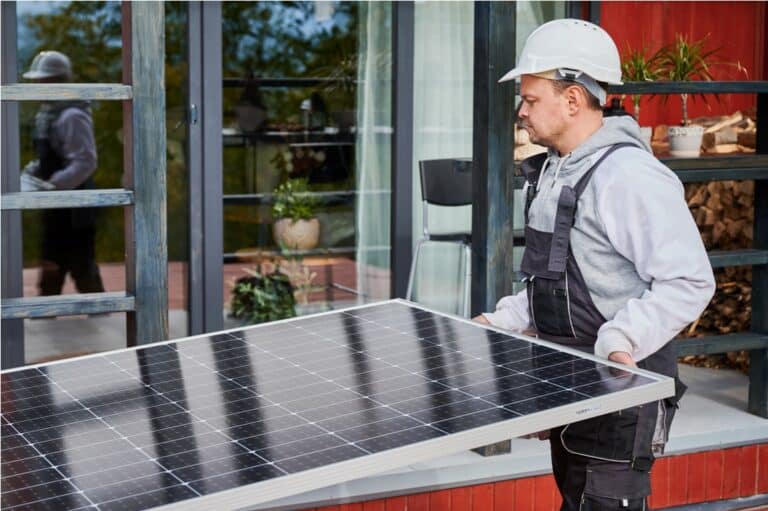 technicians carrying photovoltaic solar module whi 2023 08 22 00 25 45 utc