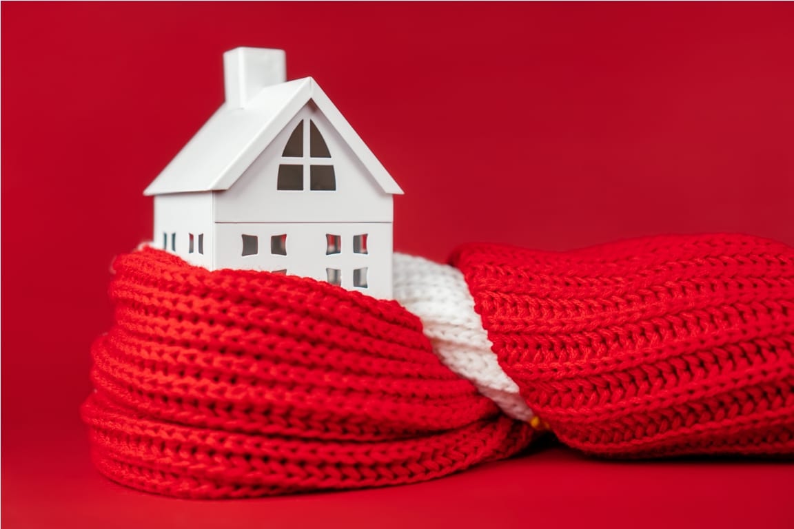 white toy house wrapped in red scarf on red backgr 2022 10 06 04 15 16 utc