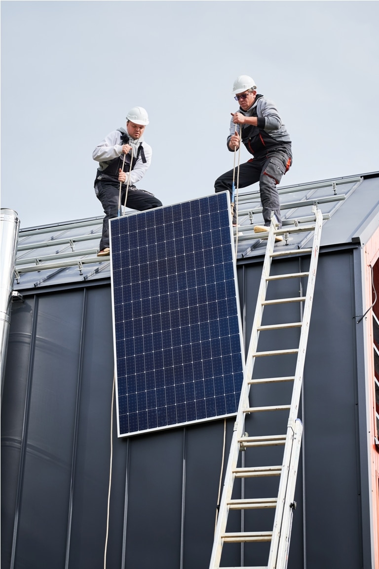 workers lifting up photovoltaic solar module while 2023 08 22 00 25 40 utc