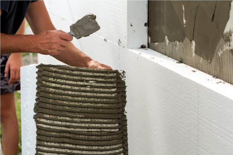 close up of detail of worker with trowel gluing wh 2022 03 15 04 51 17 utc
