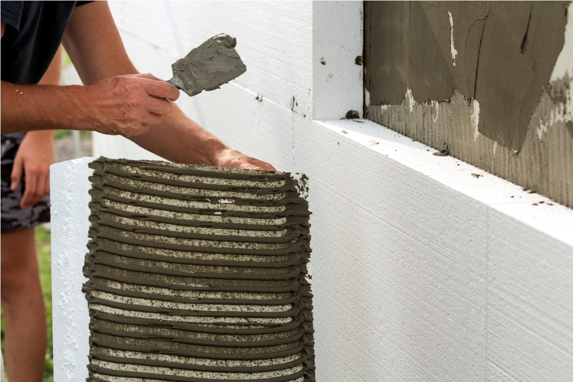 close up of detail of worker with trowel gluing wh 2022 03 15 04 51 17 utc