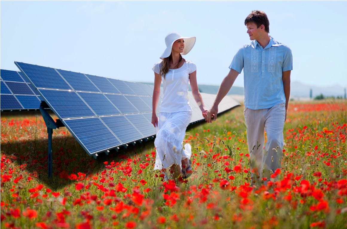 couple walking by solar panels