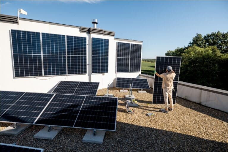 man installing solar panels on a rooftop 2023 11 23 03 40 56 utc
