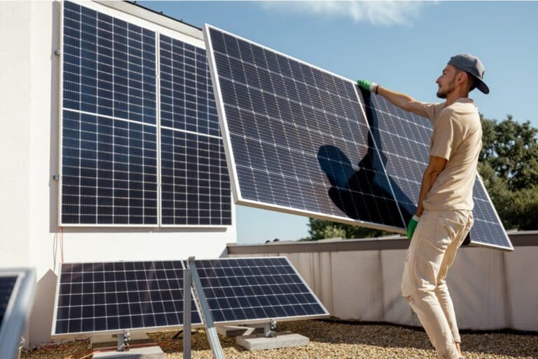 man installing solar panels on a rooftop 2023 11 23 03 42 57 utc