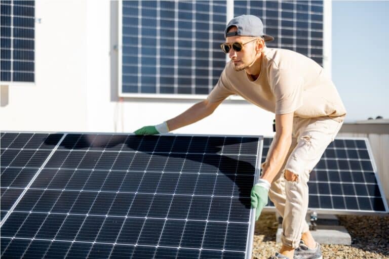 man installing solar panels on the roof of his hou 2023 11 23 03 40 56 utc (1)