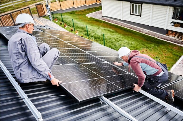 men workers installing solar panels on roof of hou 2023 09 29 17 18 09 utc