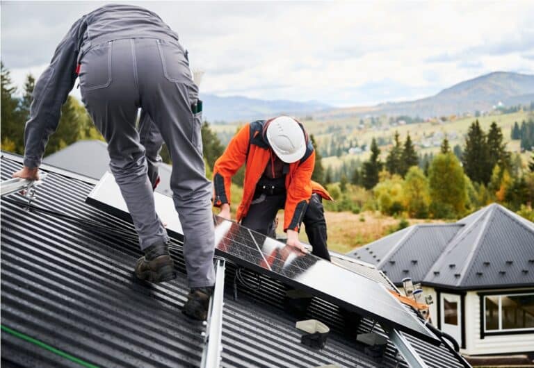 men workers installing solar panels on roof of hou 2023 09 29 17 18 16 utc
