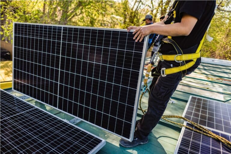 two workers technicians installing heavy solar pho 2023 06 06 17 55 06 utc