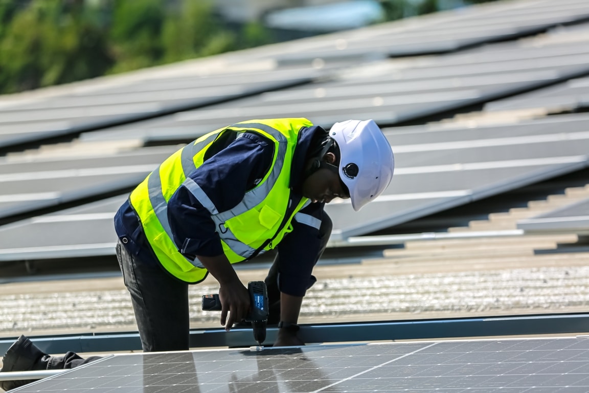 workers installing solar panels on warehouse roof 2023 06 07 17 07 56 utc