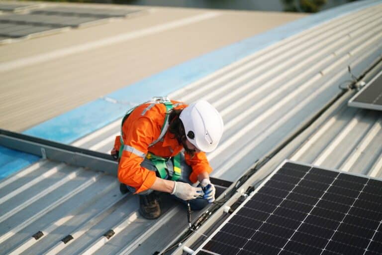 workers installing solar panels on warehouse roof 2023 06 07 17 08 06 utc