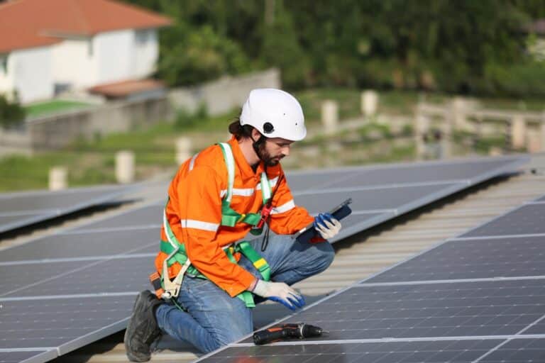 workers installing solar panels on warehouse roof 2023 06 07 17 10 49 utc