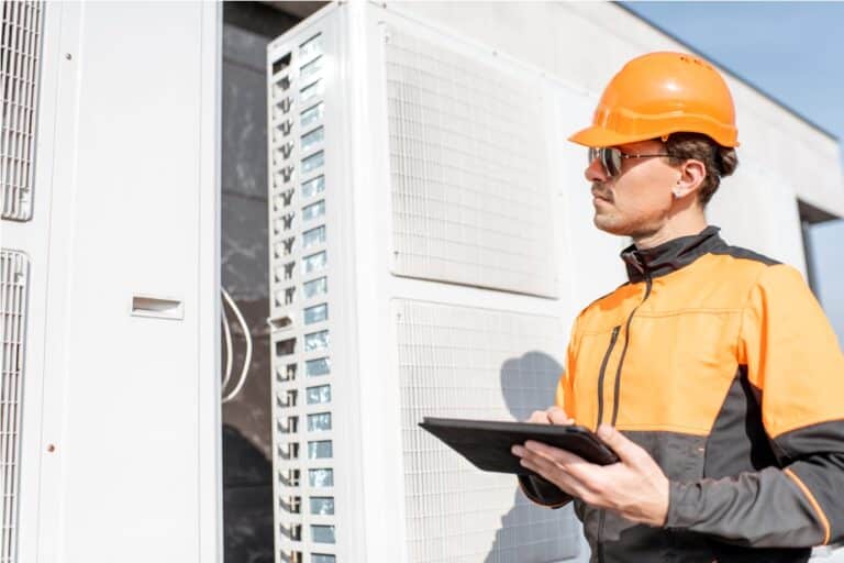 workman servicing air conditioning or heat pump wi 2021 09 01 15 21 02 utc