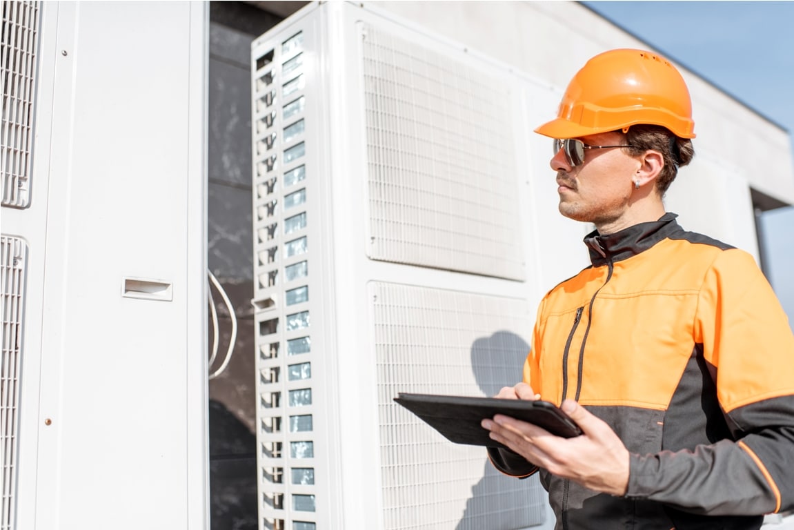 workman servicing air conditioning or heat pump wi 2021 09 01 15 21 02 utc